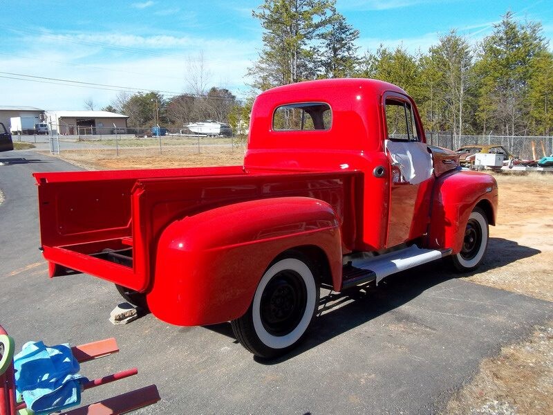 Restored red Ford pickup truck.