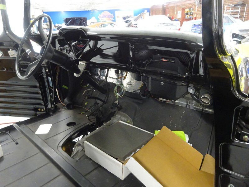 Black classic car interior dashboard restoration.