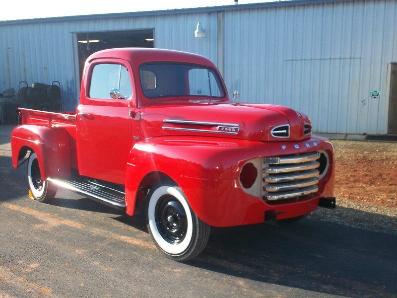 Restored red Ford pickup truck.