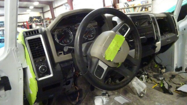 Dodge Ram truck dashboard interior during repair.
