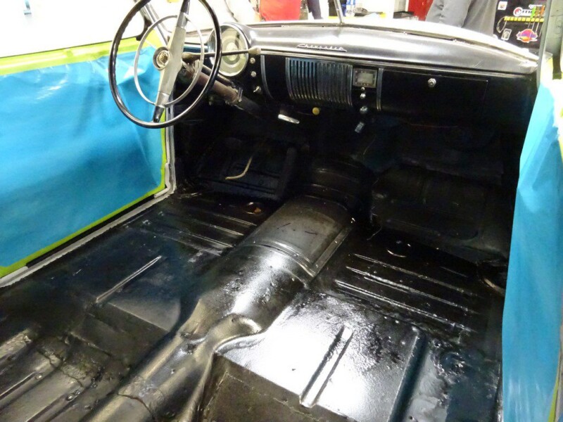Black car interior under restoration.