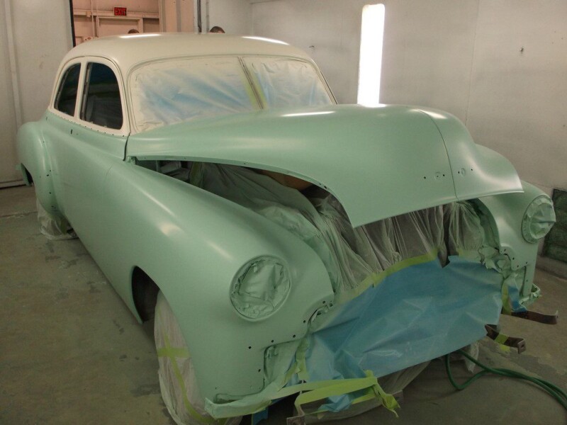 Mint green classic car, paint job in progress.