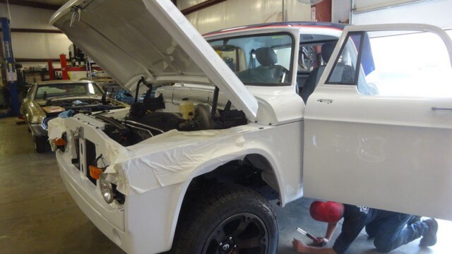 White classic truck under repair.