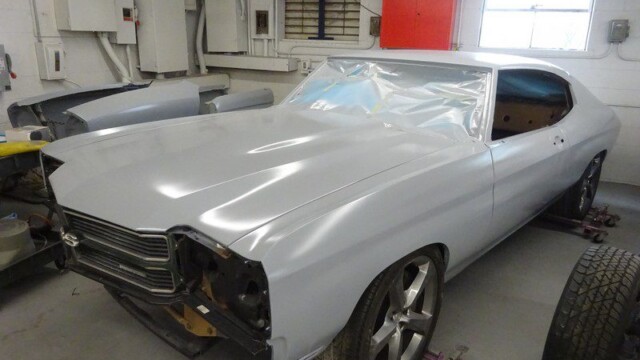 Primered Chevrolet Chevelle in auto shop.