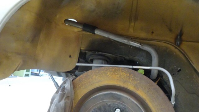 Car wheel well with suspension parts.