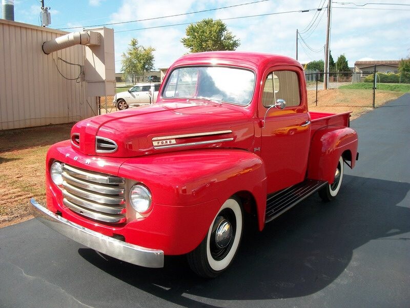 Restored red Ford pickup truck.