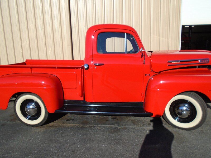 Red vintage Ford pickup truck.