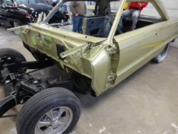 Classic car body restoration in progress.