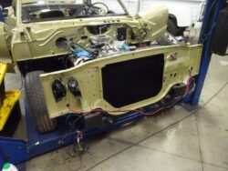 Classic car under restoration, engine bay.
