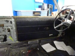 Black interior door shell with steering wheel