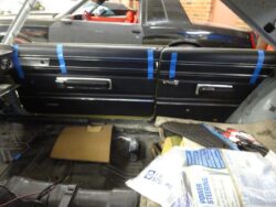 Classic car interior door panel installation.