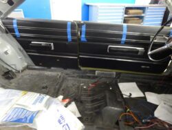 Classic car door panel installation.