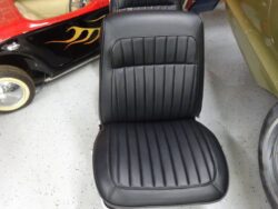 Black vinyl car seat, classic style.