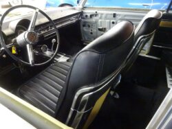 Driver side view of black leather bucket seats