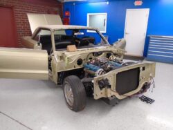 Gold vintage coupe with exposed engine