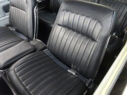 Classic car's black vinyl seats.