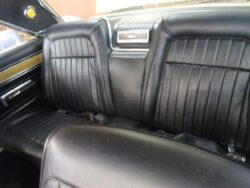Black leather rear seats in classic car.