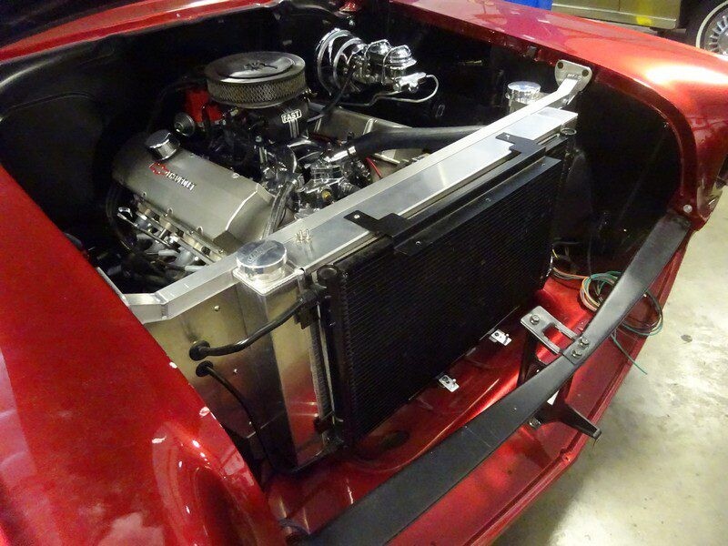 Red classic car engine bay detail.