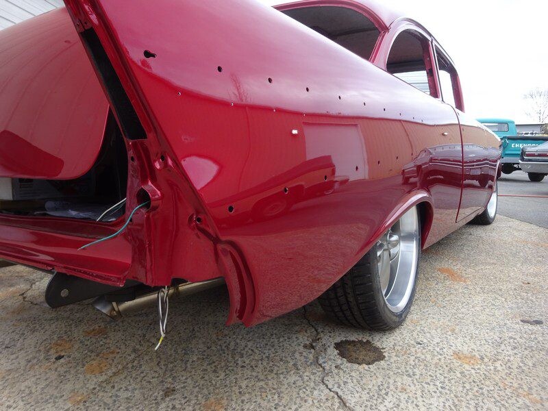 Red classic car rear quarter panel.