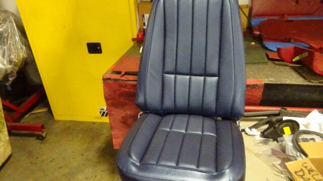 Dark blue car seat, reupholstered.