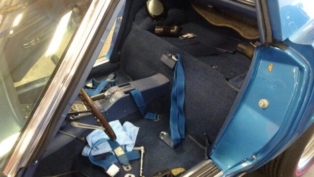Blue Corvette interior under repair.