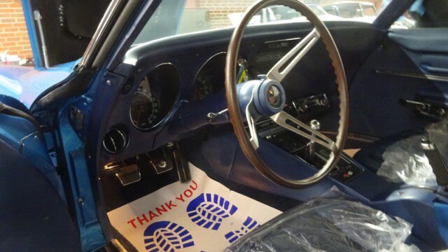 Classic car interior, blue dashboard.