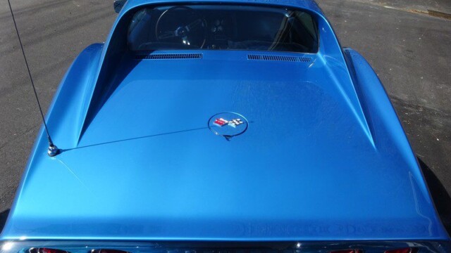 Blue Corvette Stingray rear view.