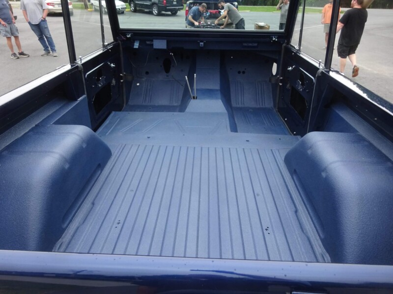 Here's an alt tag for the image: Ford Bronco truck bed, freshly painted.