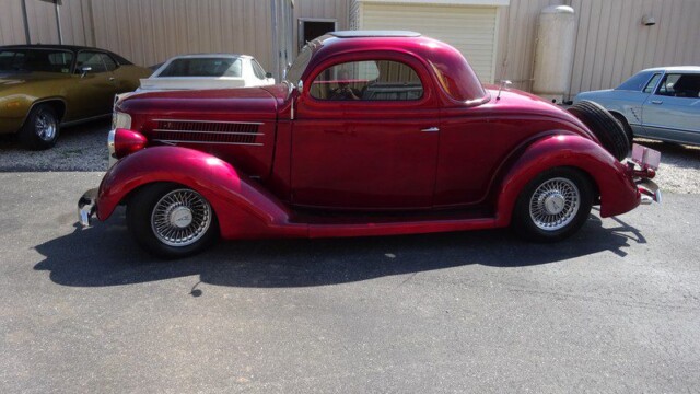 Red 1934 Ford Coupe hot rod.