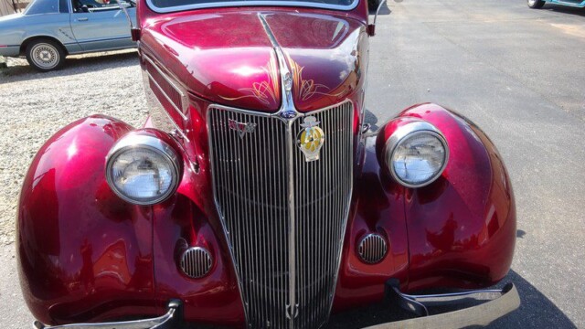 Red vintage Ford coupe, custom paint.