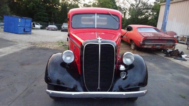 Red vintage Ford pickup truck.