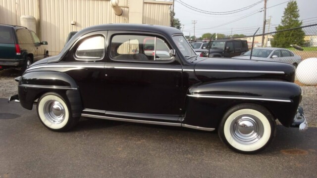 Black 1948 Ford coupe classic car.