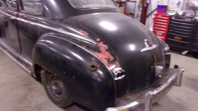 Black vintage car, rear view.