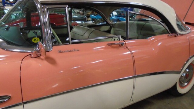 Pink and white classic Buick Roadmaster.
