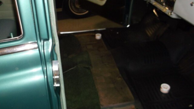 Green classic car interior details.