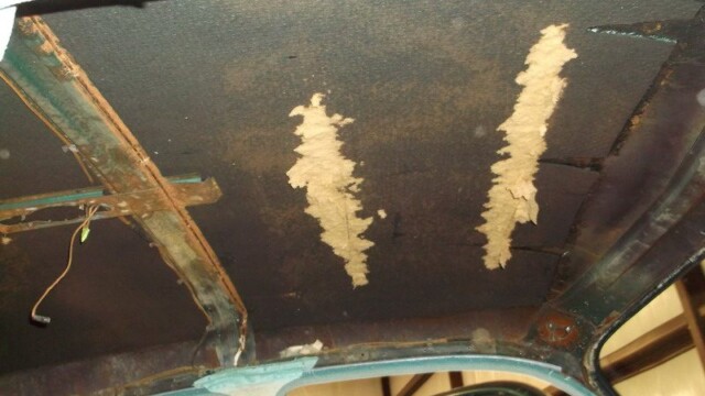 Damaged car headliner needing repair.