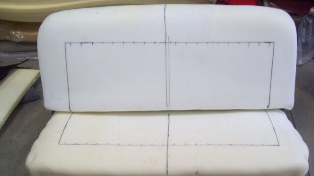 Foam bench seat cushions marked for cutting.