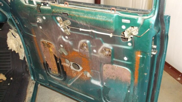Rusty car door interior panel.