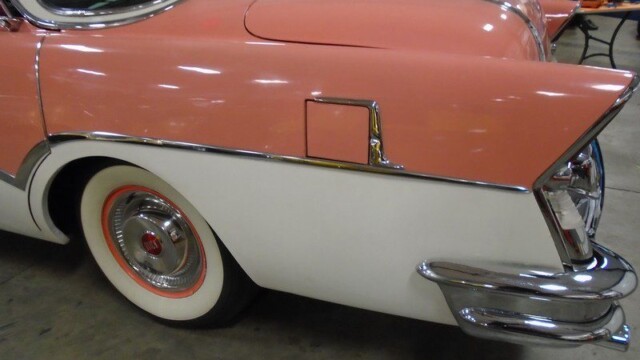 Pink and white vintage Buick rear fender.