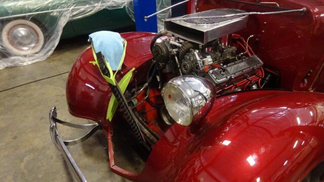 Red classic car engine detail.