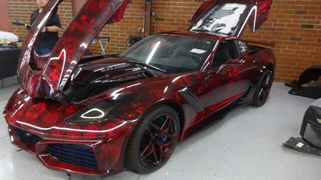 Red Corvette with custom paint job.