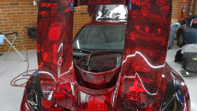 Red Corvette with military tribute wrap.