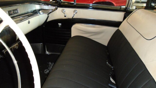 Black and beige Buick car interior.