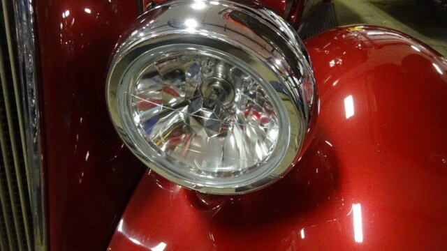 Classic car headlight, red body.