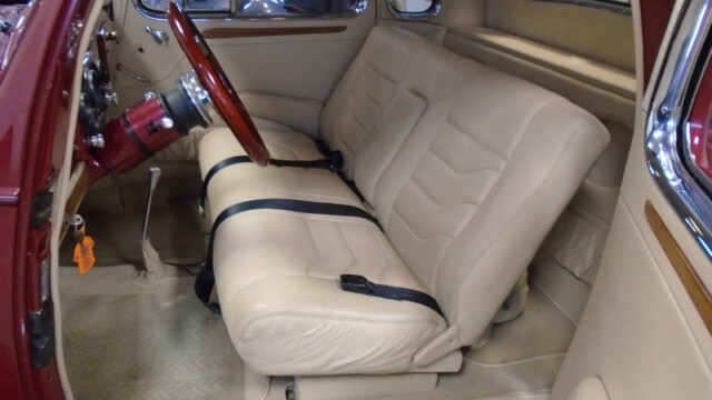 Classic car's interior, cream leather seats.