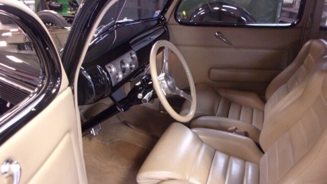 Tan interior of a classic Ford car.