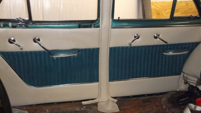 Classic car teal and beige interior.