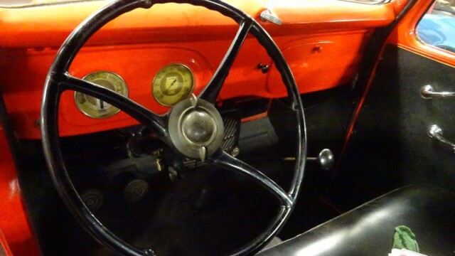 Red vintage Ford truck interior.