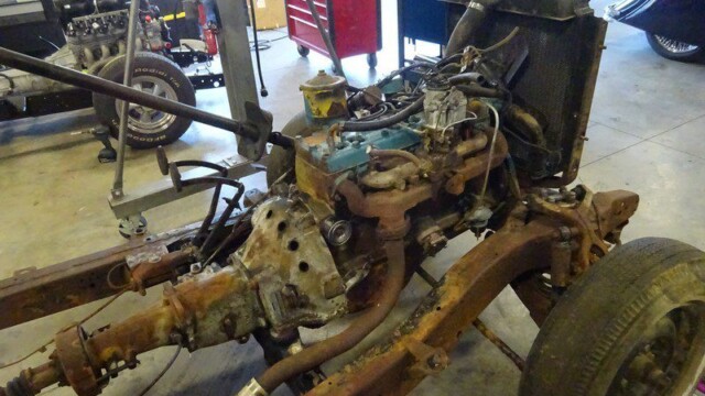 Rusty car engine and chassis restoration.