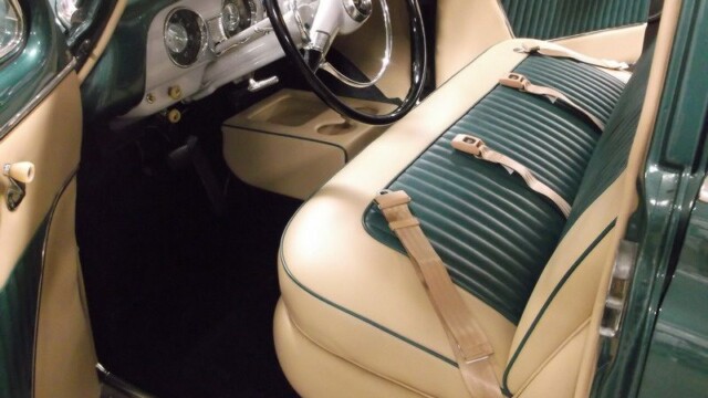 Vintage car's green and beige interior.